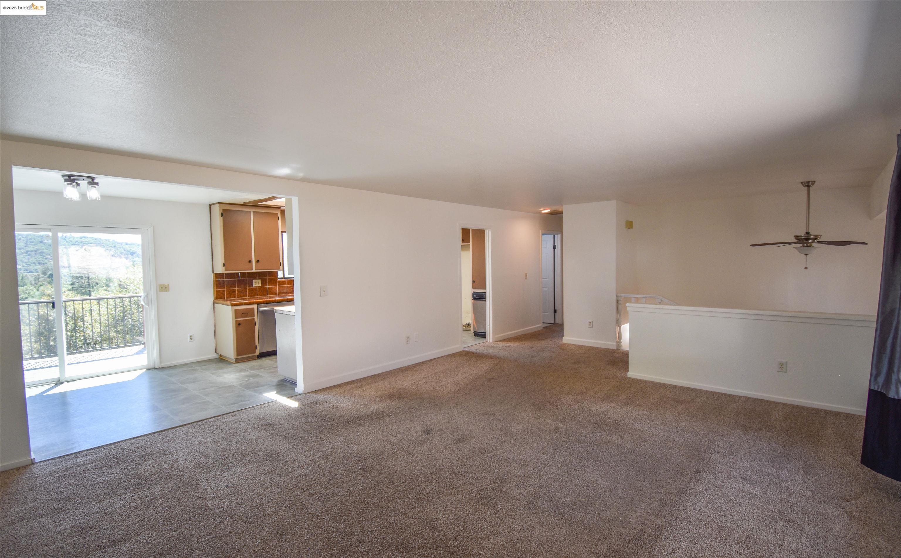 21850 Phoenix Lake Road Sonora, CA 95370 - Photo 12 of 39 an empty room with a empty space and windows