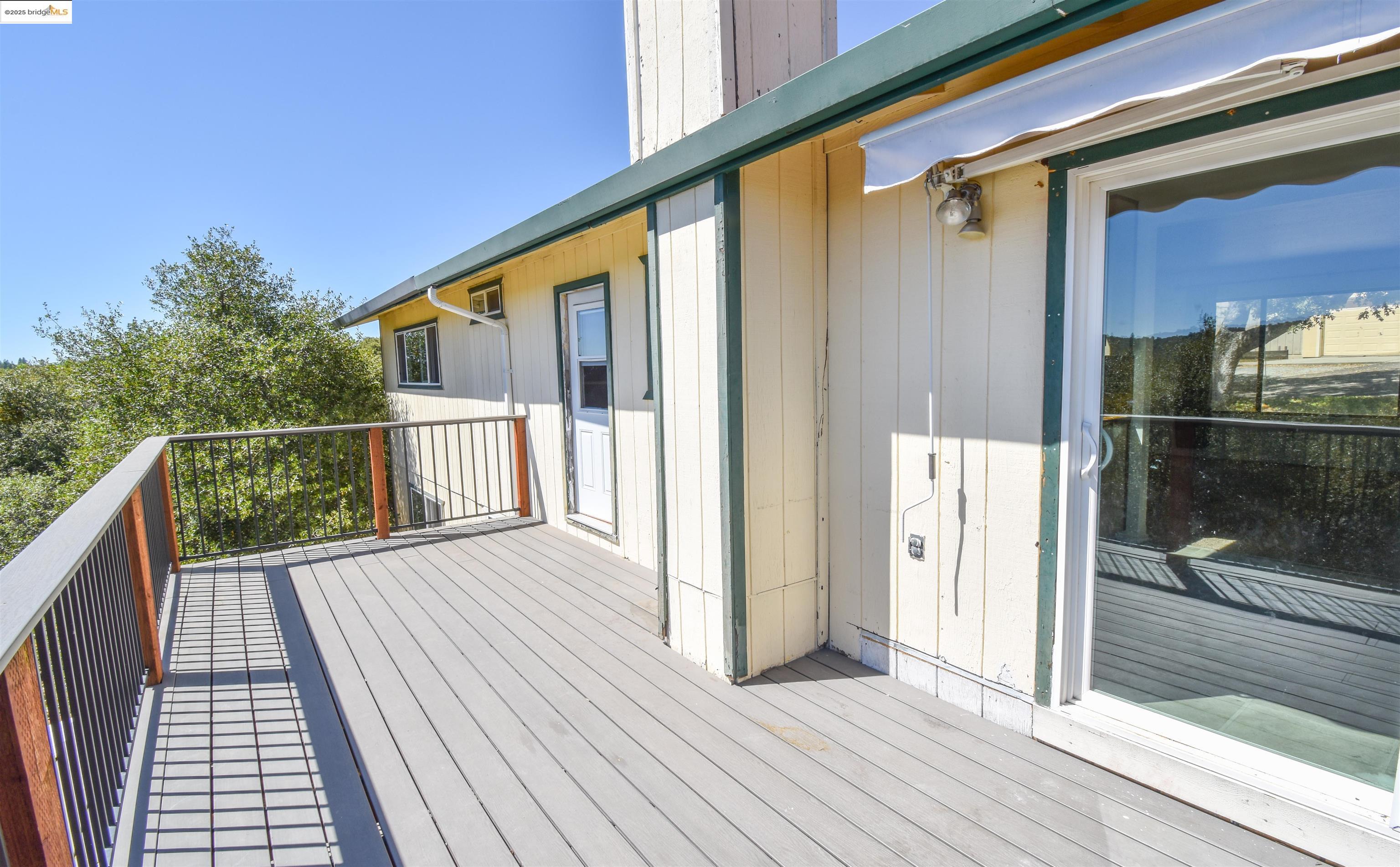 21850 Phoenix Lake Road Sonora, CA 95370 - Photo 35 of 39 a view of a balcony with wooden floor and fence