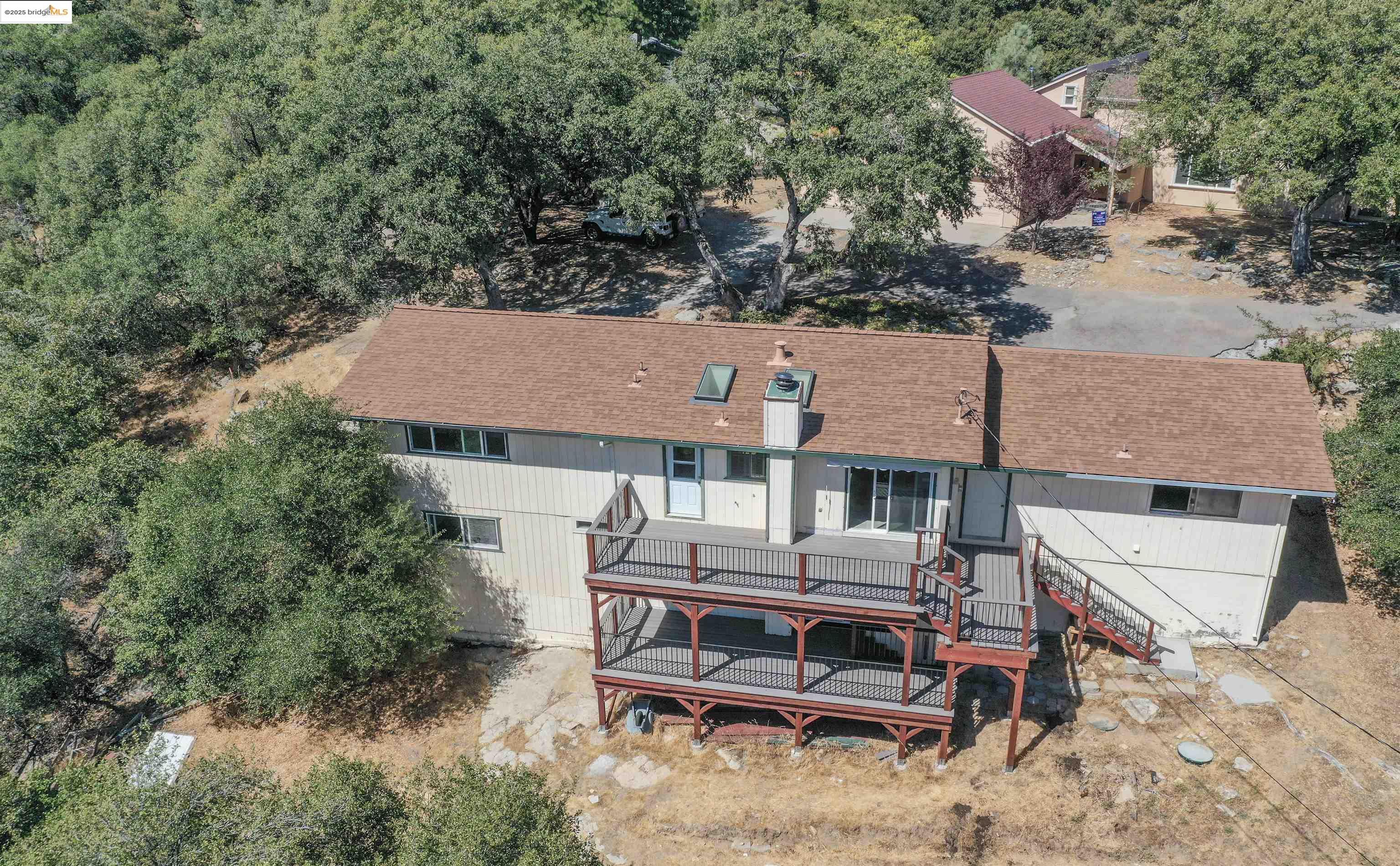 21850 Phoenix Lake Road Sonora, CA 95370 - Photo 4 of 39 an aerial view of a house with table and chairs