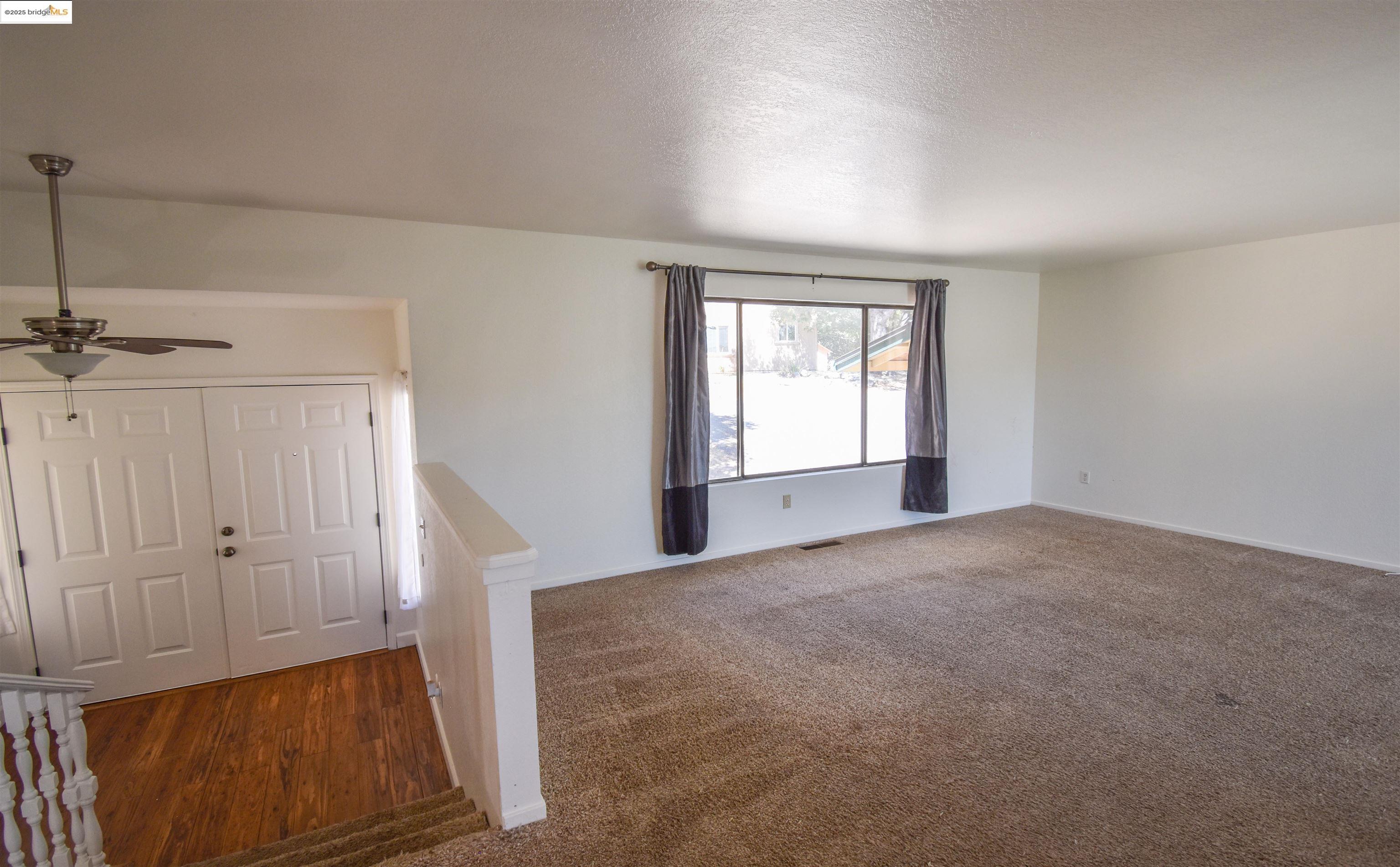 21850 Phoenix Lake Road Sonora, CA 95370 - Photo 10 of 39 an empty room with windows