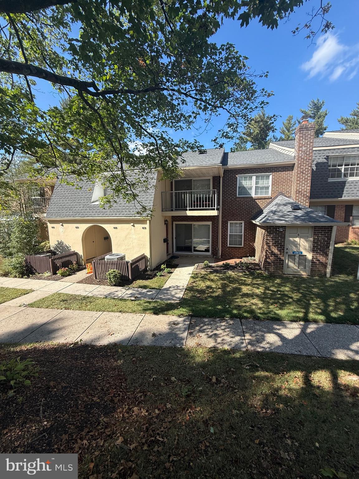 76 Old Forge Crossing, Unit 76 Devon, PA 19333 - Photo 2 of 17 a front view of a house with a yard
