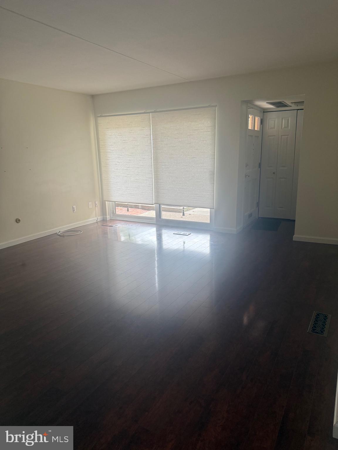 76 Old Forge Crossing, Unit 76 Devon, PA 19333 - Photo 5 of 17 a view of empty room with wooden floor and fan