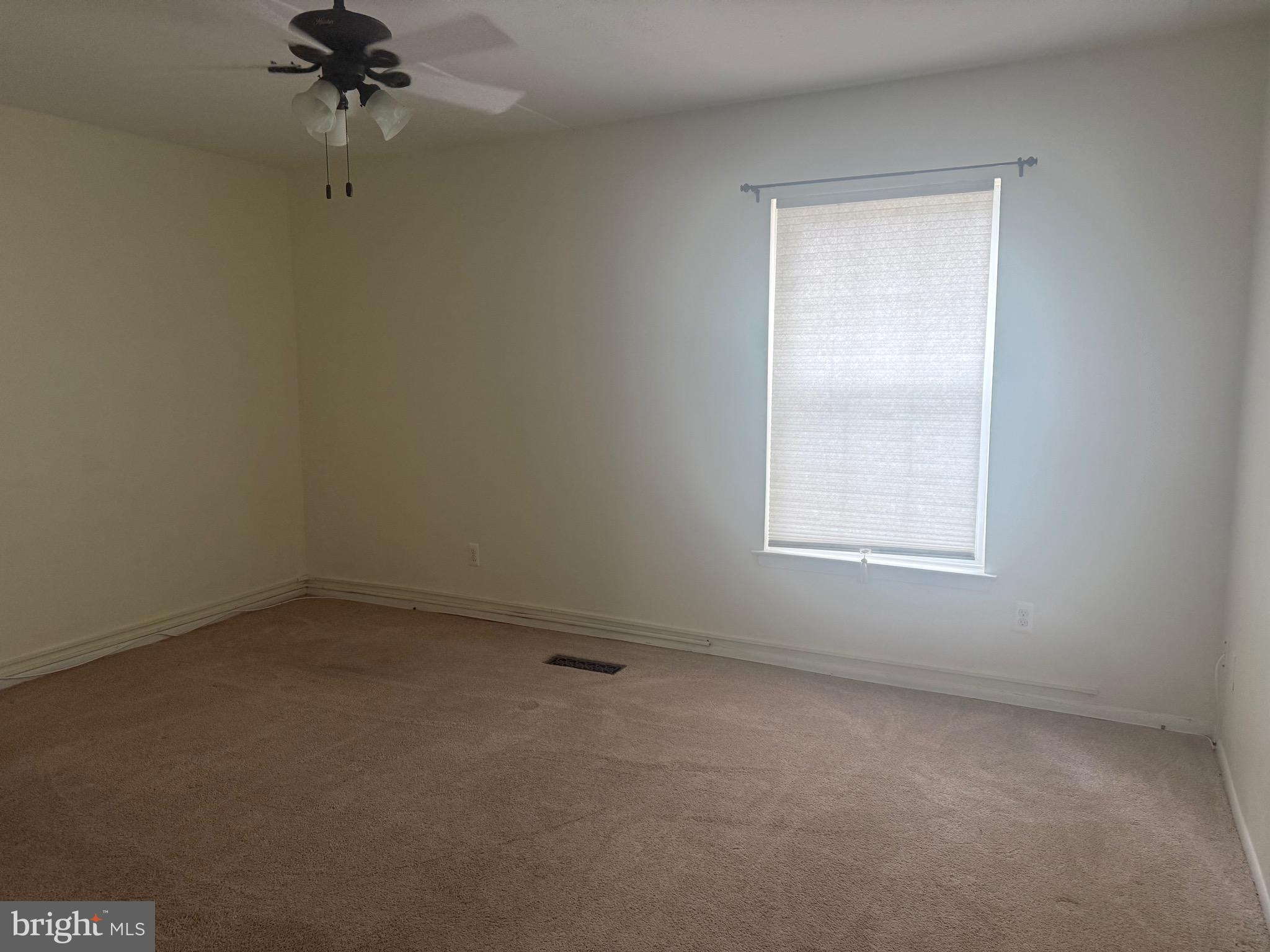 76 Old Forge Crossing, Unit 76 Devon, PA 19333 - Photo 10 of 17 an empty room with a fan and a window
