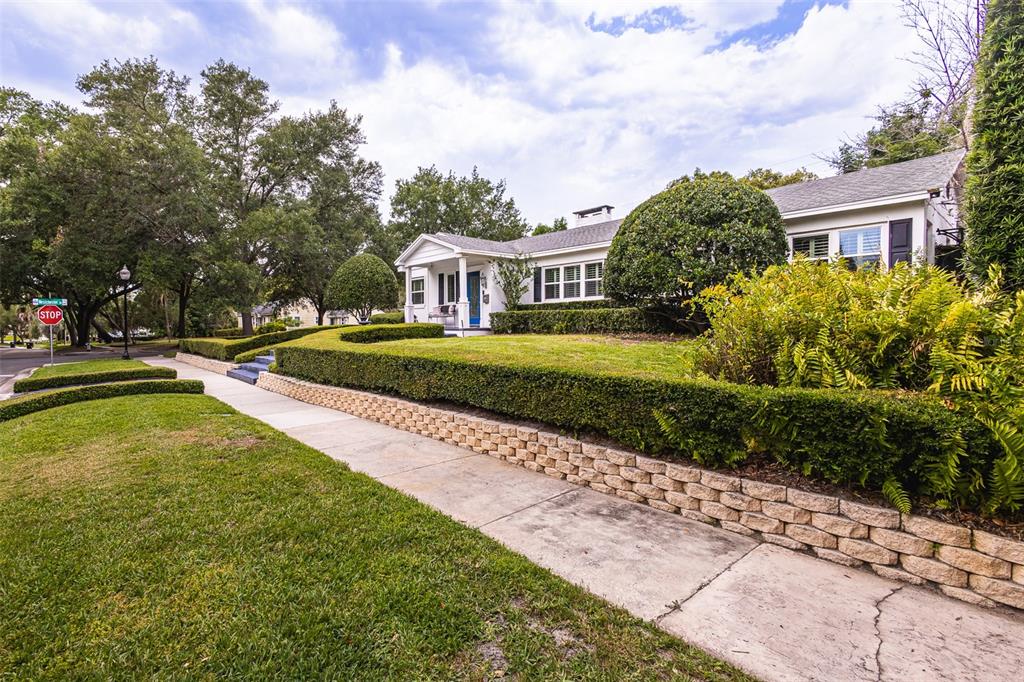 1001 Nottingham Street Orlando, FL 32803 - Photo 43 of 49 a front view of a house with a yard table and chairs