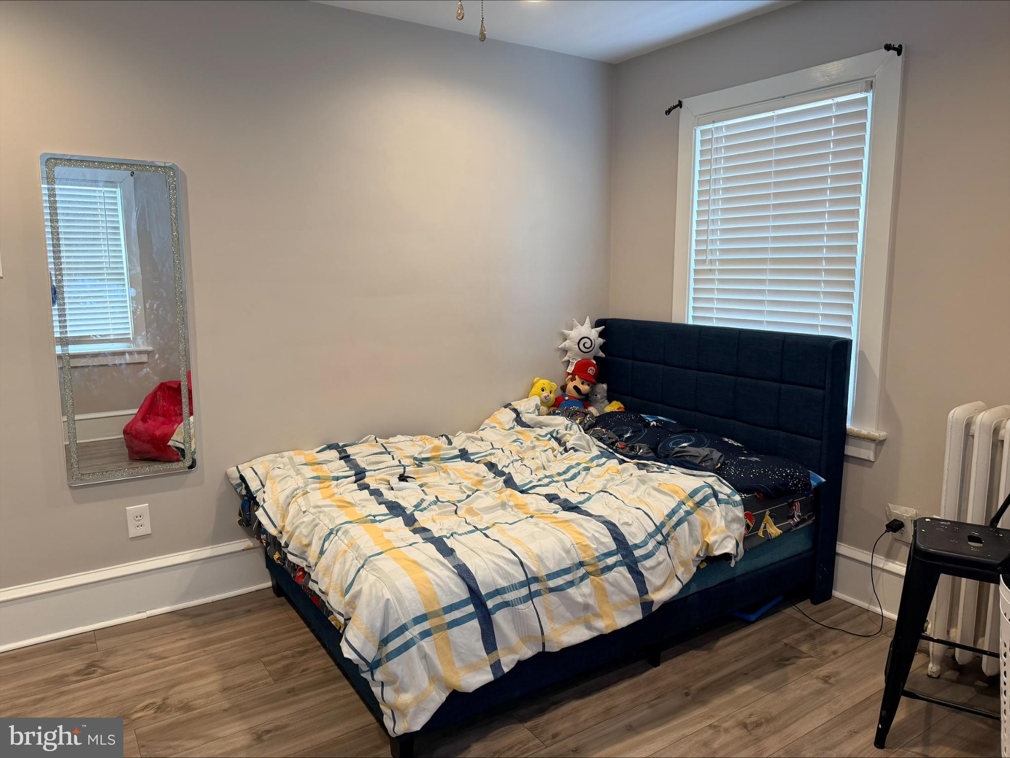 283 West Commerce St Extension Bridgeton, NJ 08302 - Photo 11 of 27 a bedroom with a bed and wooden floor