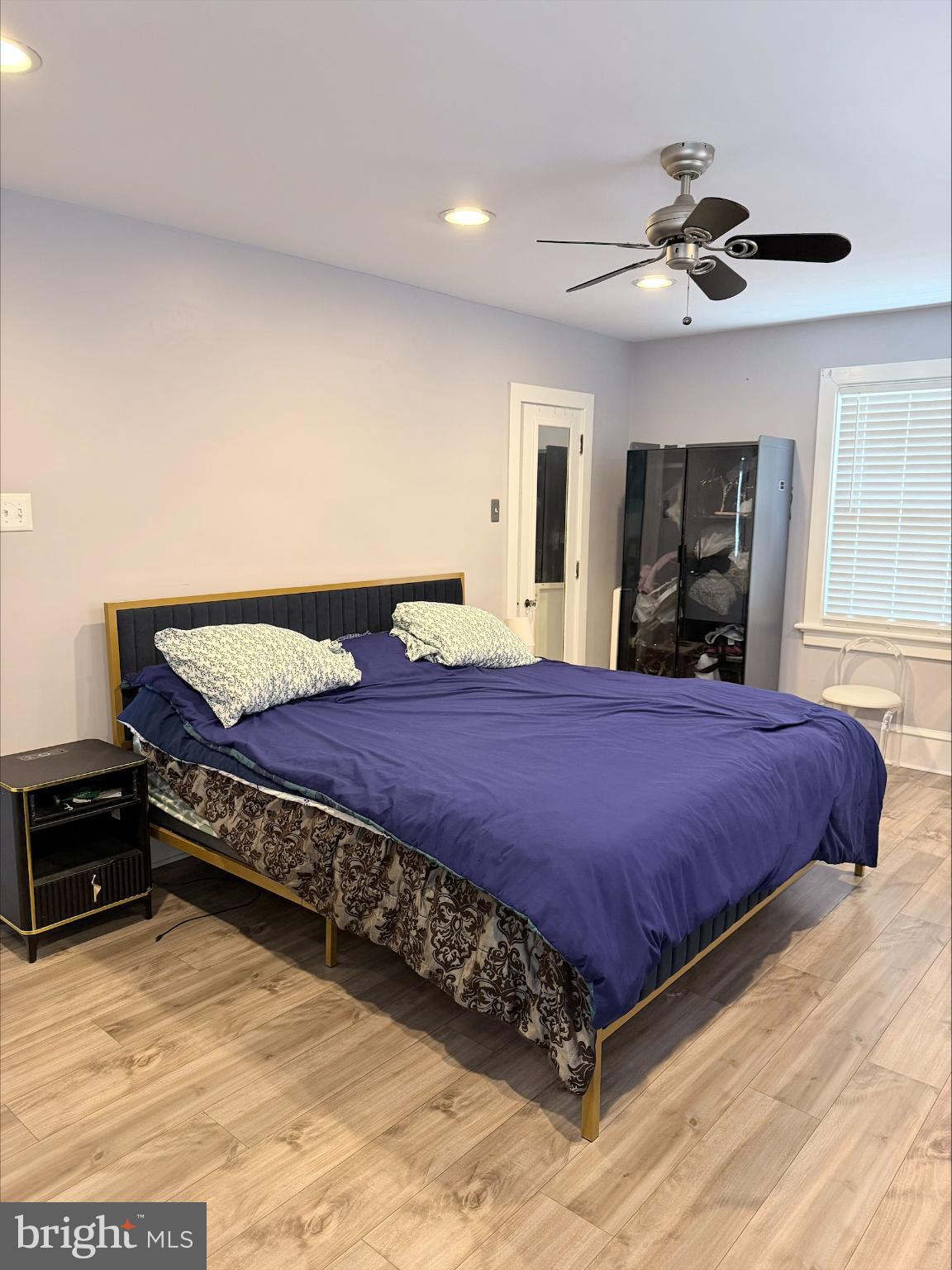 283 West Commerce St Extension Bridgeton, NJ 08302 - Photo 16 of 27 a large bed sitting in a bedroom next to a window and a chandelier