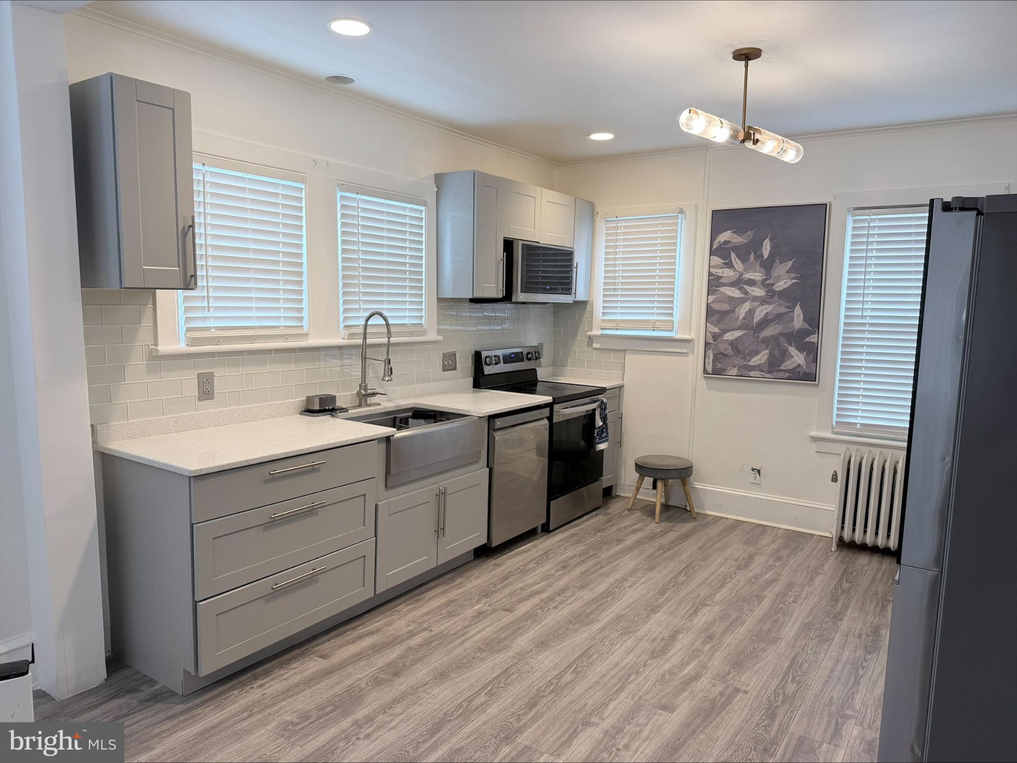 283 West Commerce St Extension Bridgeton, NJ 08302 - Photo 22 of 27 a kitchen with a sink window and cabinets