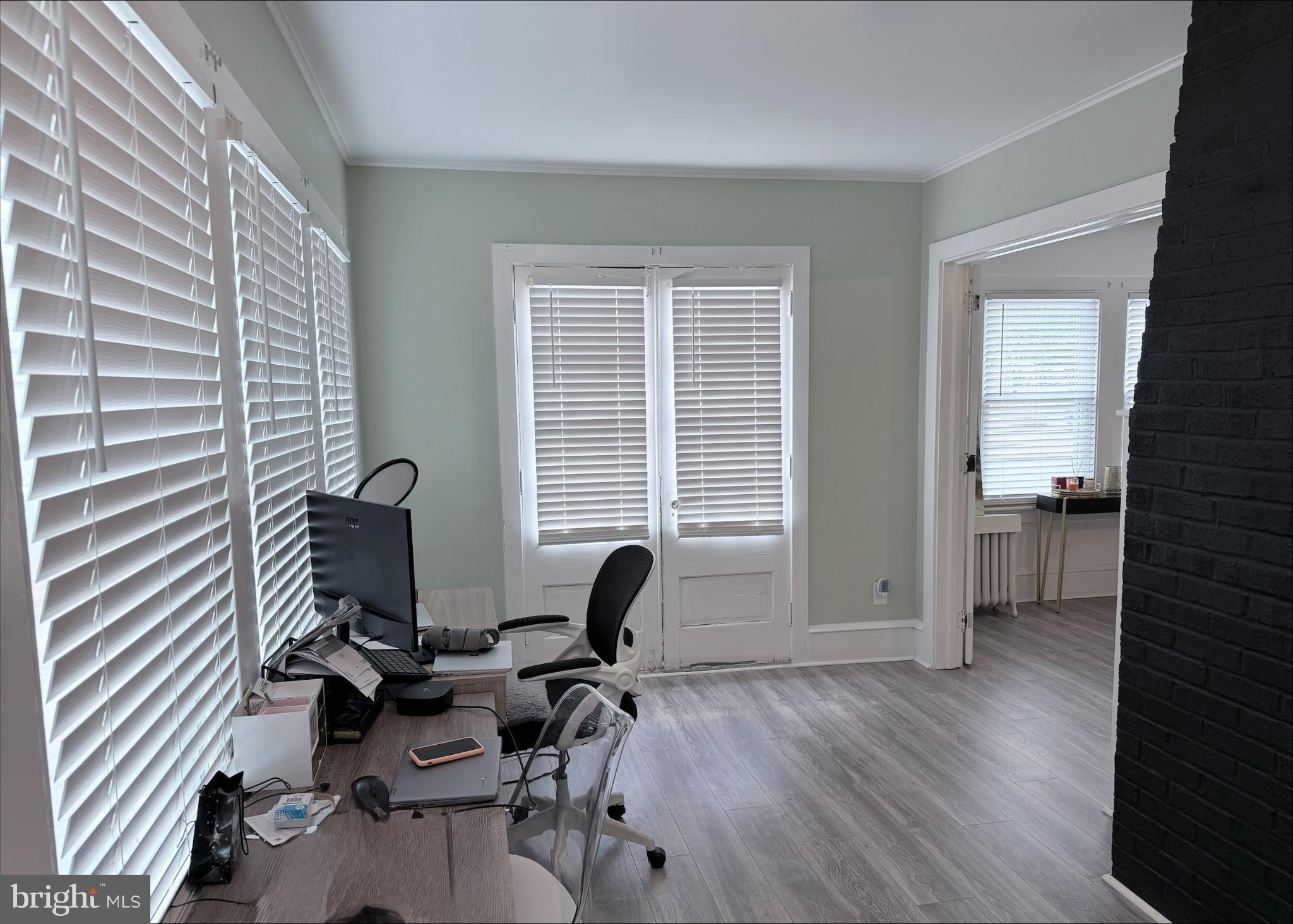 283 West Commerce St Extension Bridgeton, NJ 08302 - Photo 3 of 27 a view of a workspace with furniture and a window