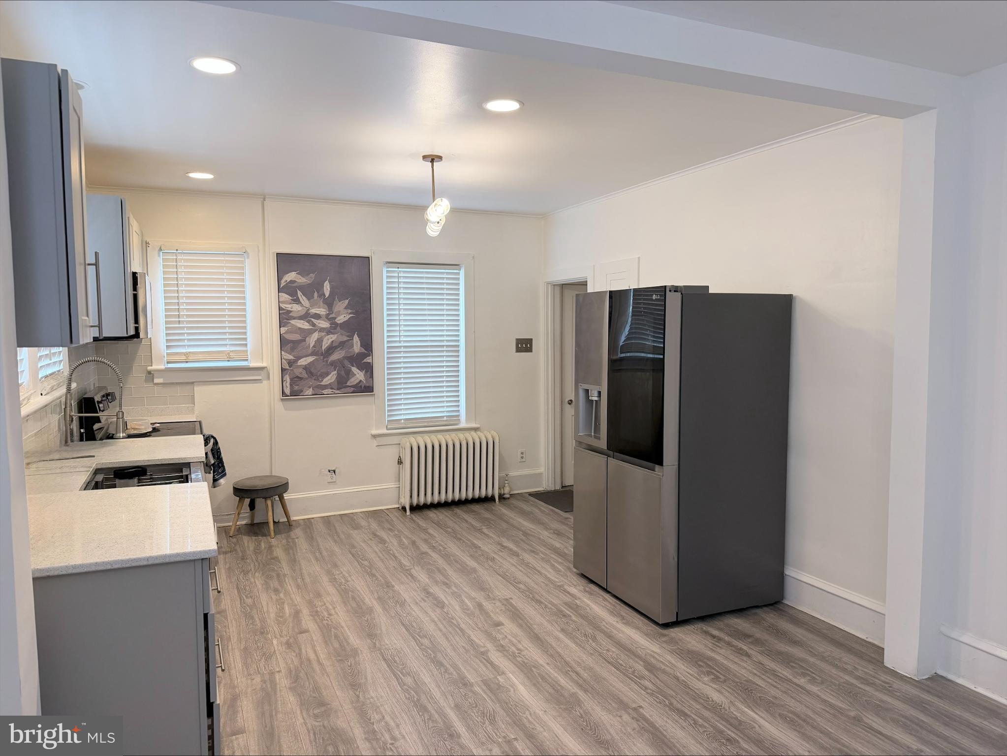 283 West Commerce St Extension Bridgeton, NJ 08302 - Photo 7 of 27 a kitchen with a refrigerator and a sink