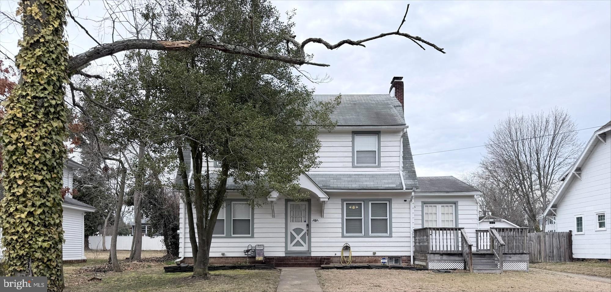 283 West Commerce St Extension Bridgeton, NJ 08302 - Photo 9 of 27 a front view of a house with a tree