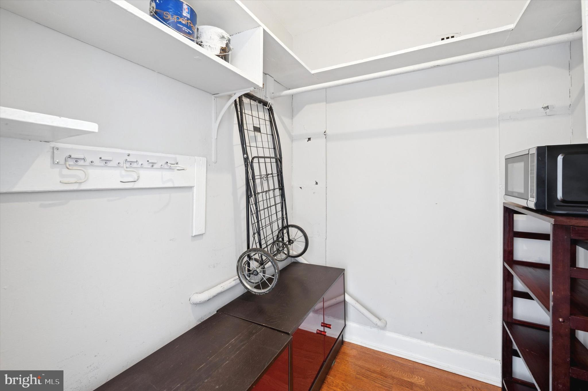 1324 Locust Street, Unit 1125 Philadelphia, PA 19107 - Photo 13 of 16 a view of storage and utility room with wooden floor