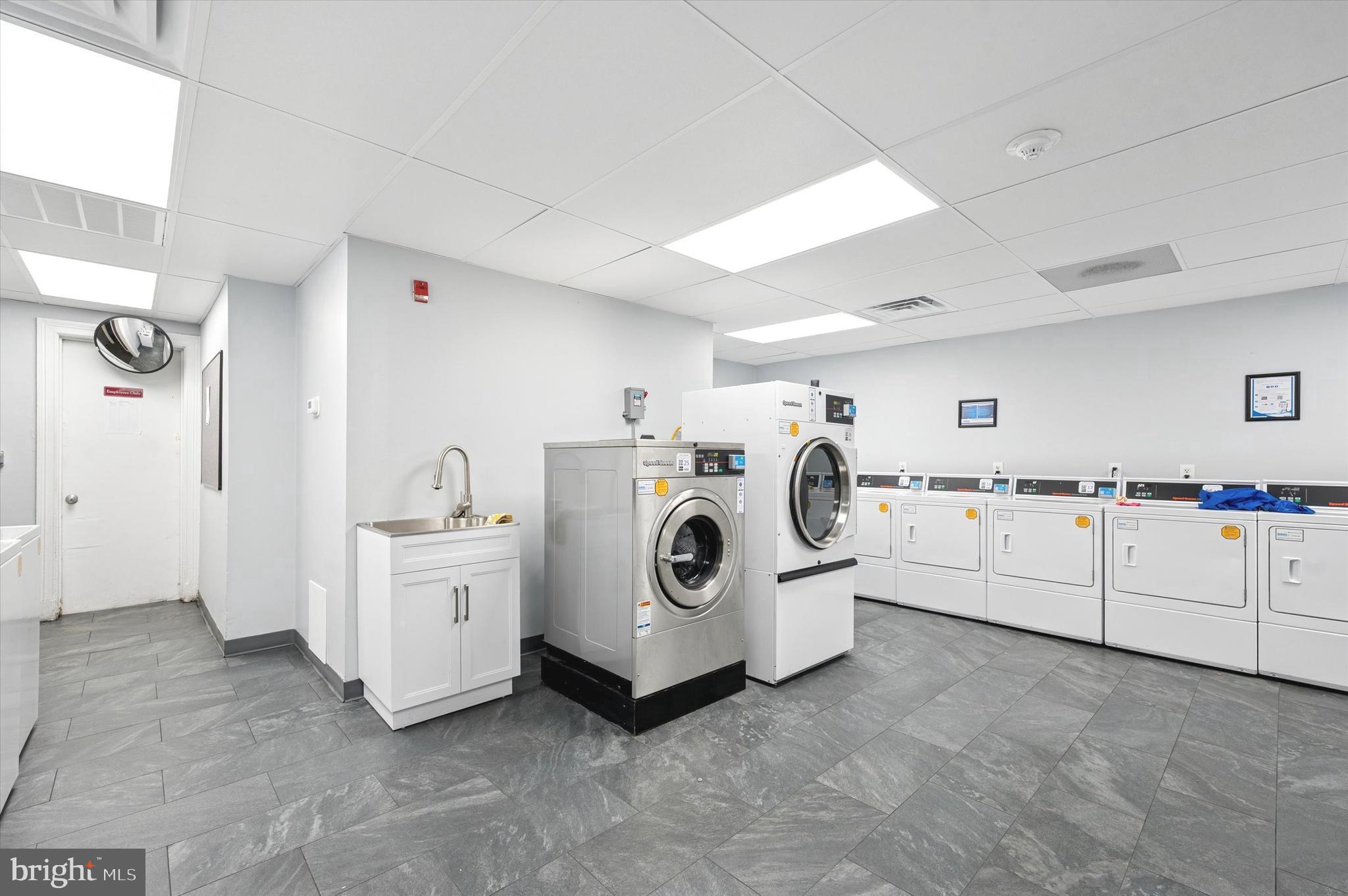 1324 Locust Street, Unit 1125 Philadelphia, PA 19107 - Photo 14 of 16 a utility room with dryer and washer