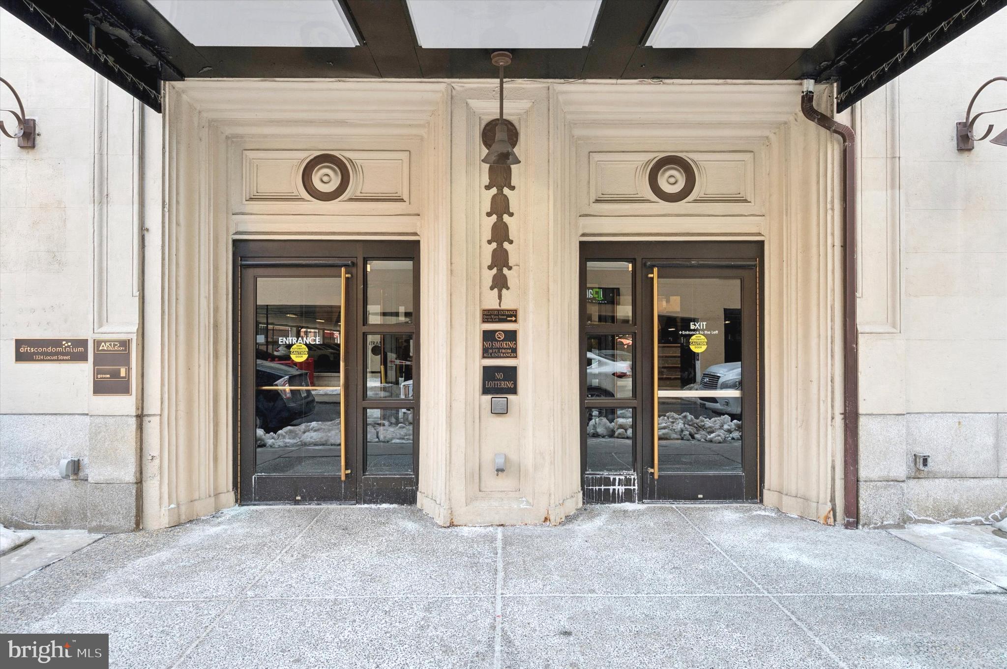 1324 Locust Street, Unit 1125 Philadelphia, PA 19107 - Photo 9 of 16 a view of a hallway with a wooden door