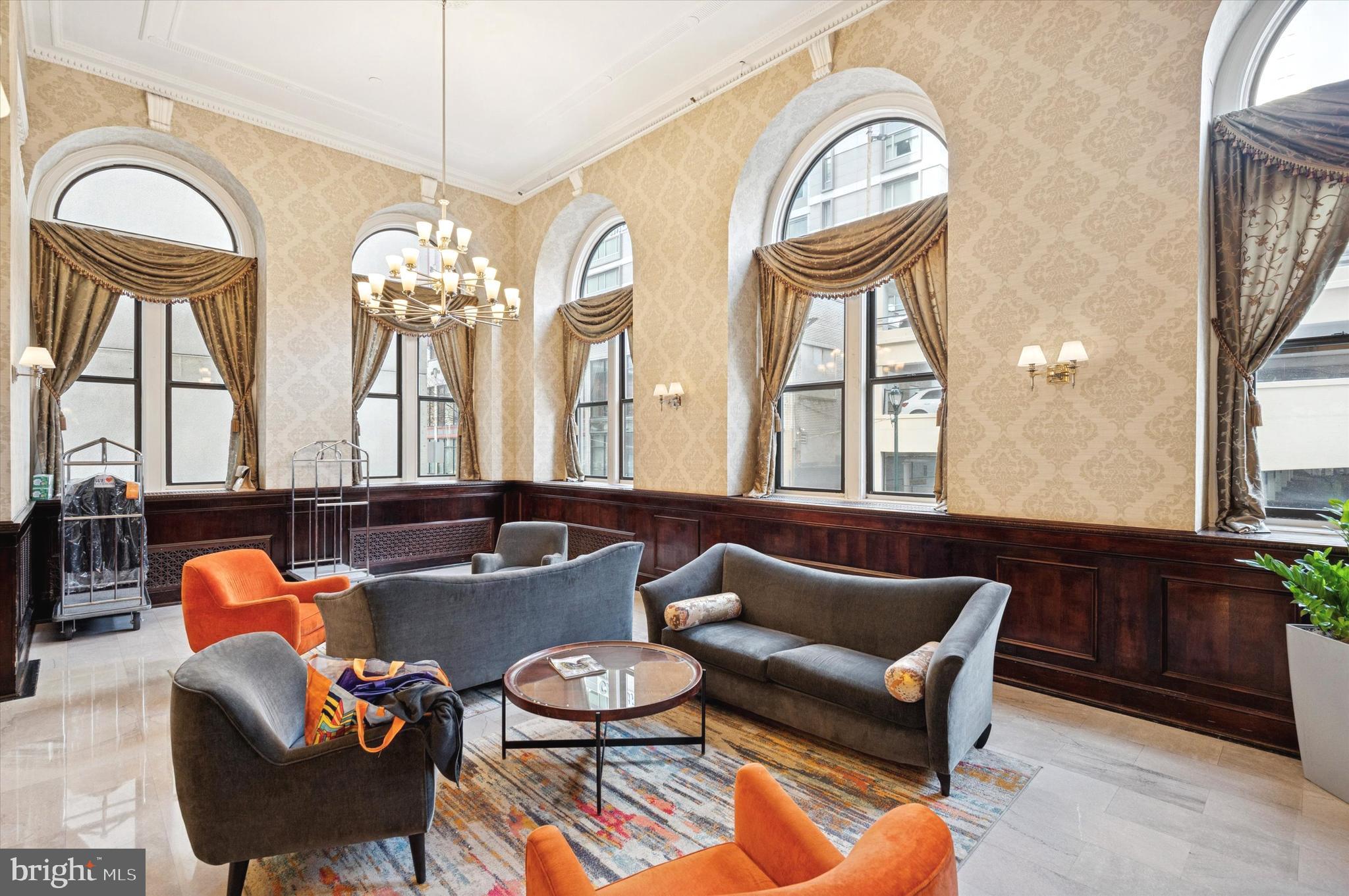 1324 Locust Street, Unit 1125 Philadelphia, PA 19107 - Photo 10 of 16 a living room with furniture and a large window