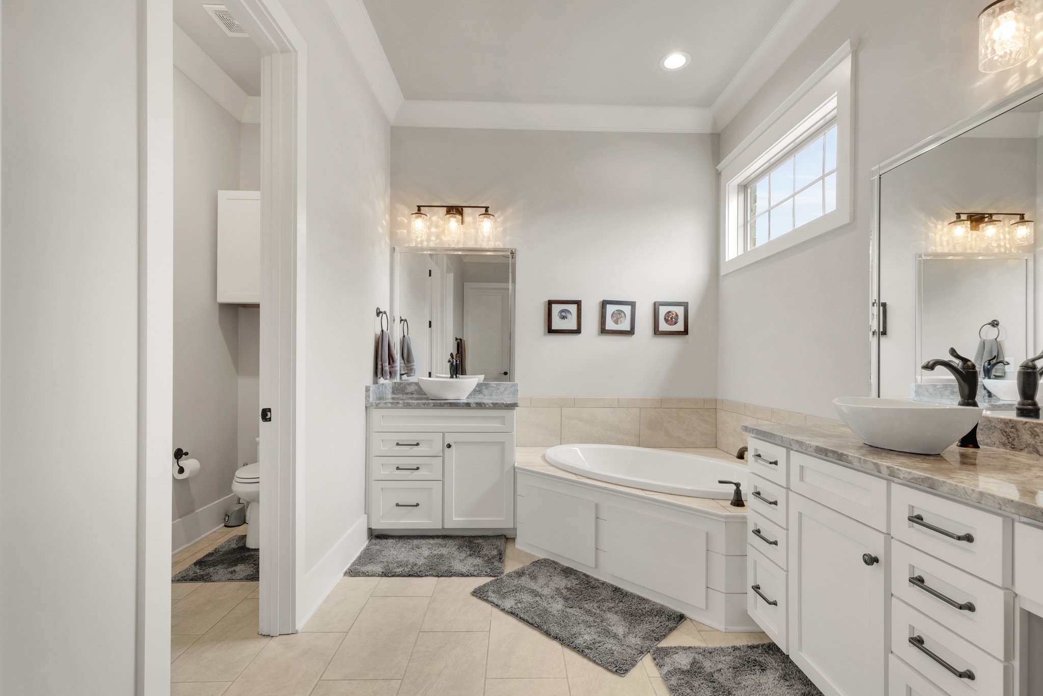 5007 Brill Ln Spring Hill Spring Hill, TN 37174 - Photo 16 of 51 a spacious bathroom with a granite countertop sink mirror and a
