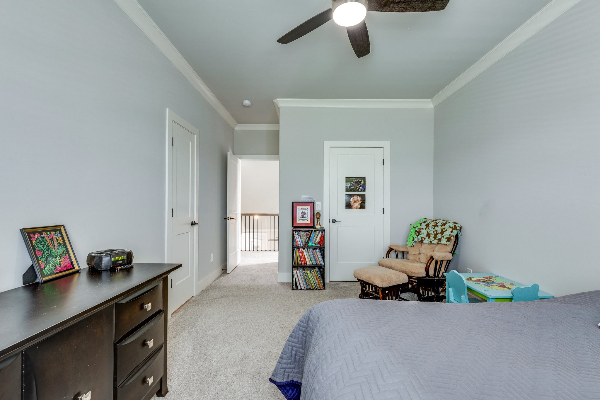 5007 Brill Ln Spring Hill Spring Hill, TN 37174 - Photo 22 of 51 a bedroom with a bed and a chandelier