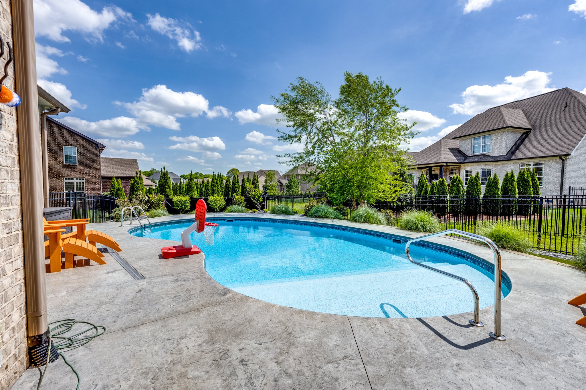 5007 Brill Ln Spring Hill Spring Hill, TN 37174 - Photo 44 of 51 a view of a swimming pool with a slide and a small yard