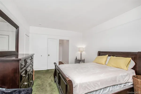 a bathroom with a bathtub a sink and mirror