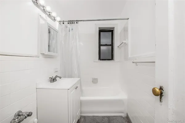 a view of a hallway with washer and dryer