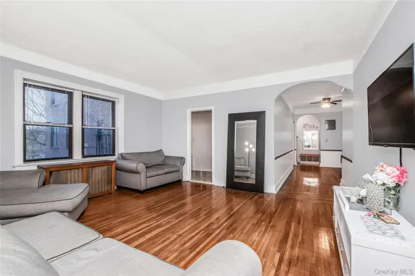 a view of a livingroom with furniture and wooden floor