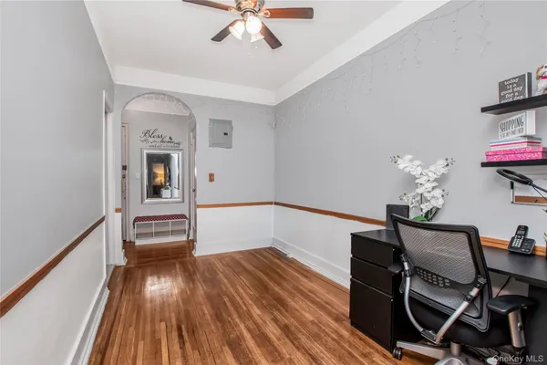 a view of a room with wooden floor and staircase