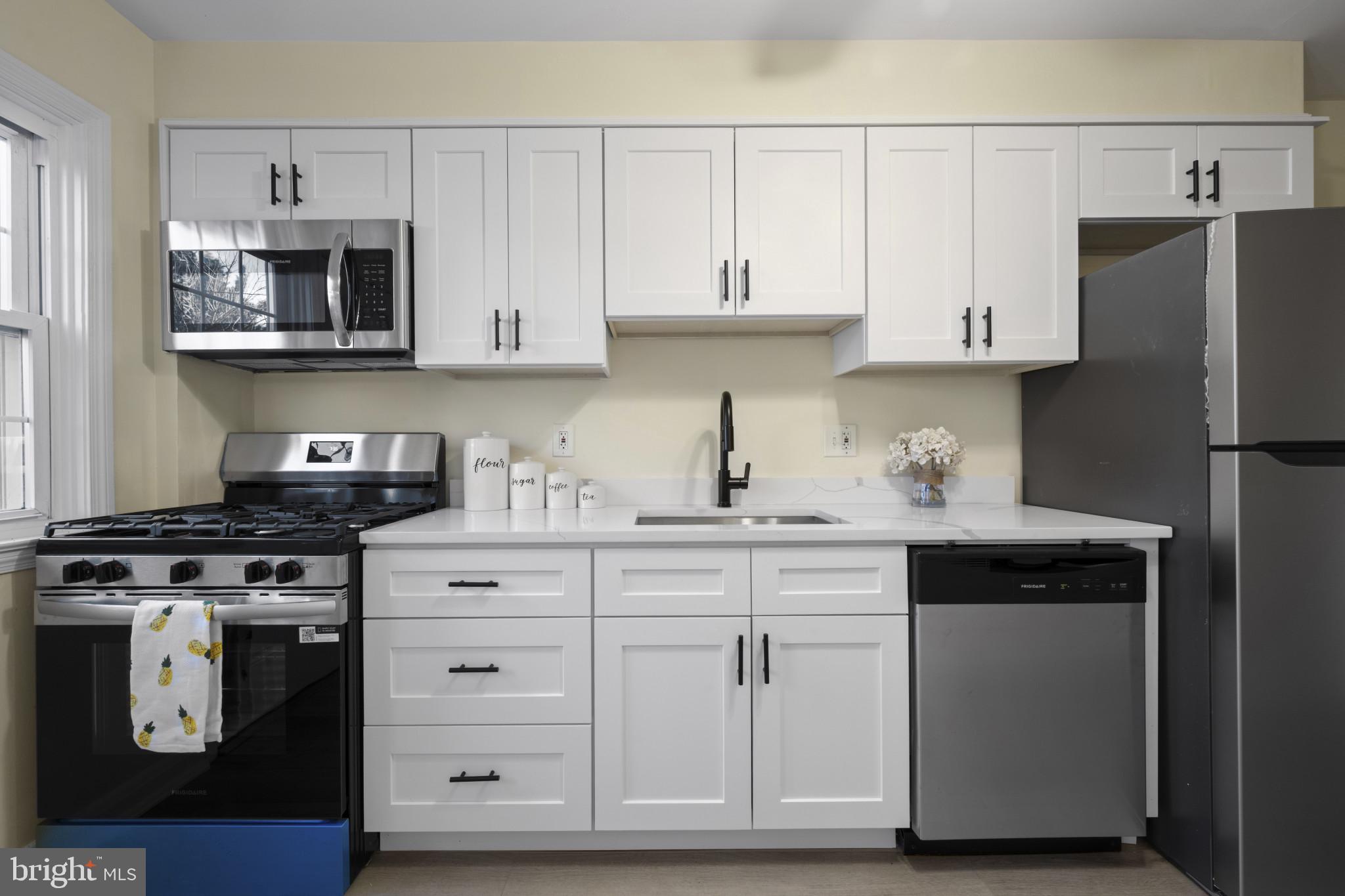 132 Overbrook Road Baltimore, MD 21212 - Photo 12 of 36 a kitchen with cabinets appliances and a counter