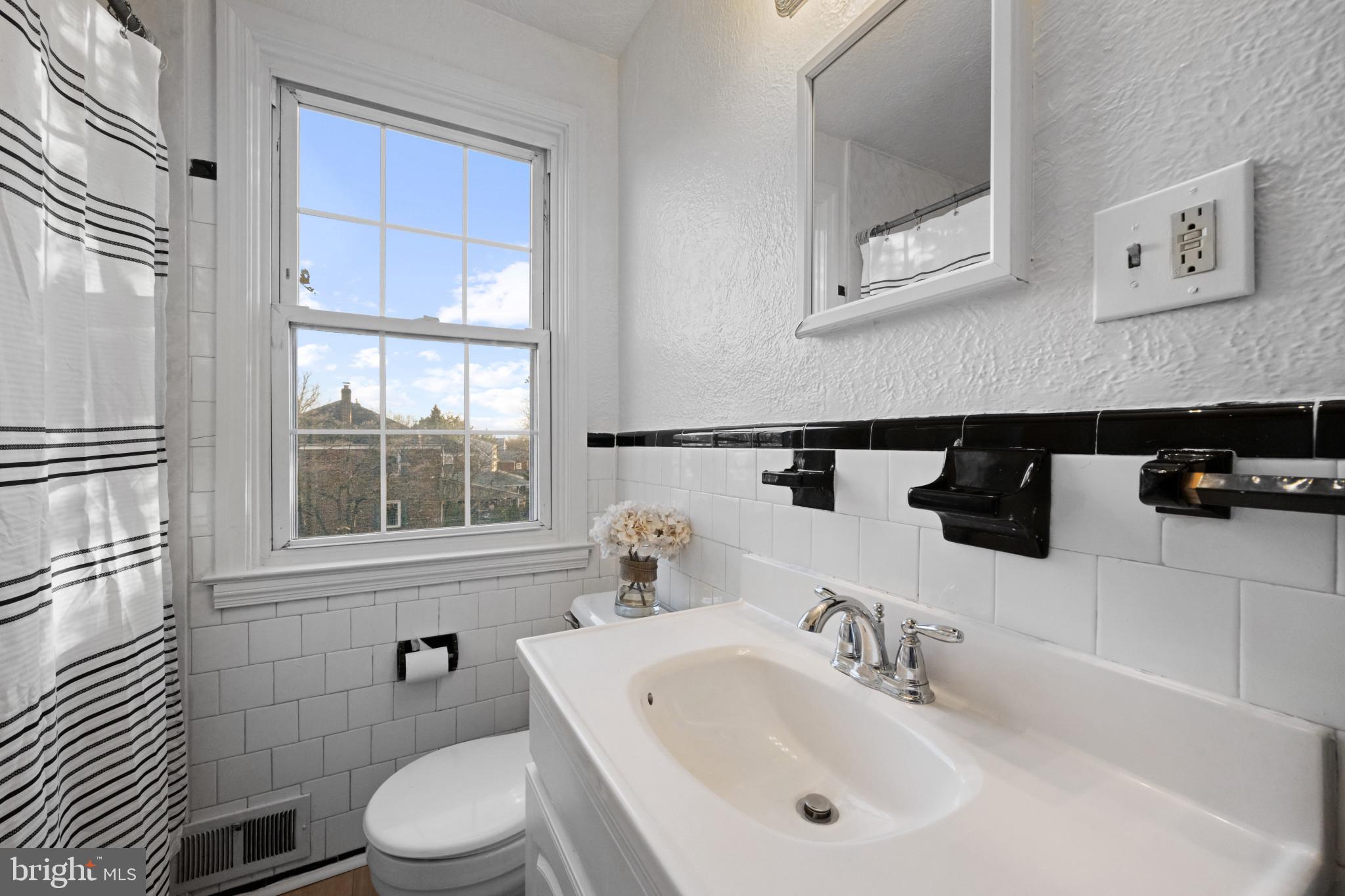 132 Overbrook Road Baltimore, MD 21212 - Photo 22 of 36 a bathroom with a sink and a toilet