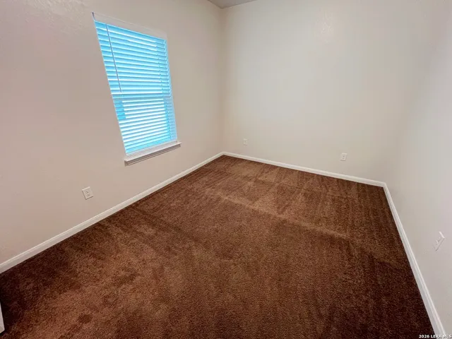 a view of kitchen and kitchen with a large window