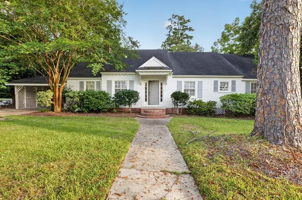 front view of a house with a yard