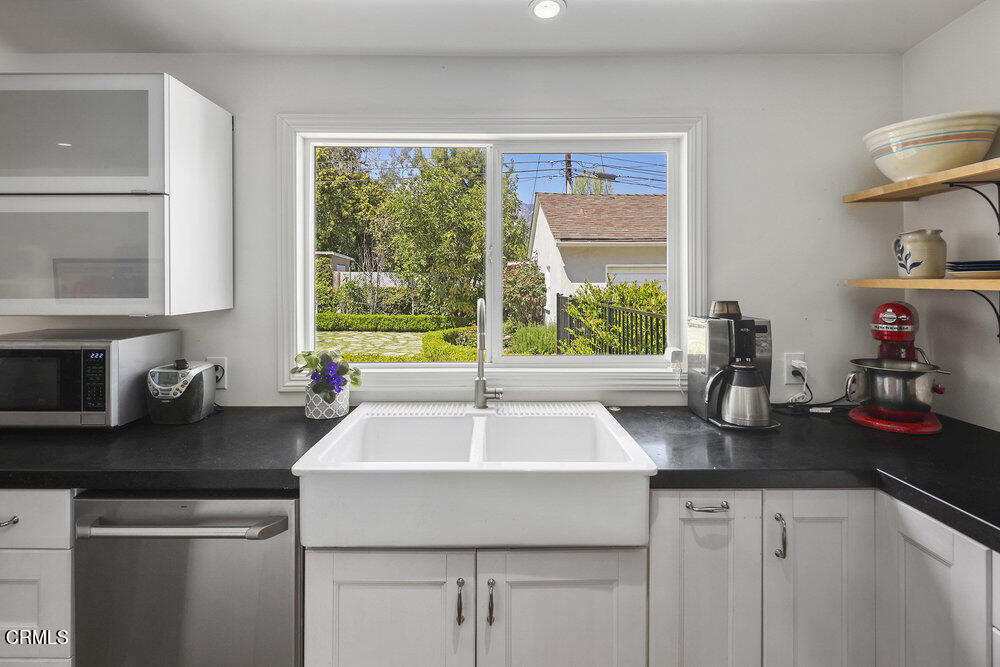 3657 Thorndale Road Pasadena, CA 91107 - Photo 15 of 44 a kitchen with sink a window and cabinets