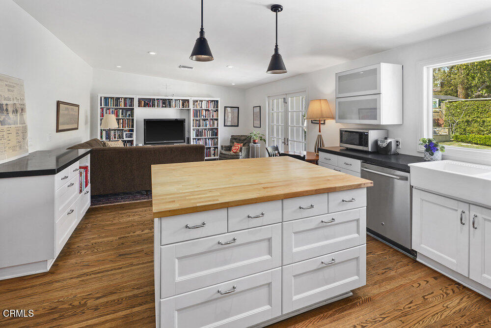 3657 Thorndale Road Pasadena, CA 91107 - Photo 18 of 44 a kitchen with stainless steel appliances kitchen island granite countertop a sink and cabinets