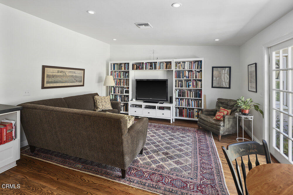 3657 Thorndale Road Pasadena, CA 91107 - Photo 22 of 44 a living room with furniture and a flat screen tv