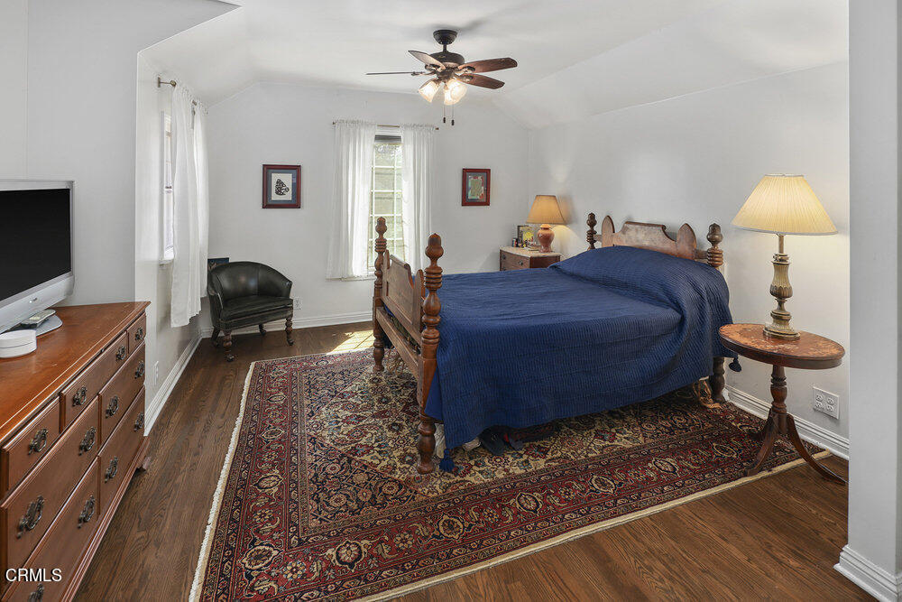 3657 Thorndale Road Pasadena, CA 91107 - Photo 24 of 44 a bed room with a bed and a chandelier