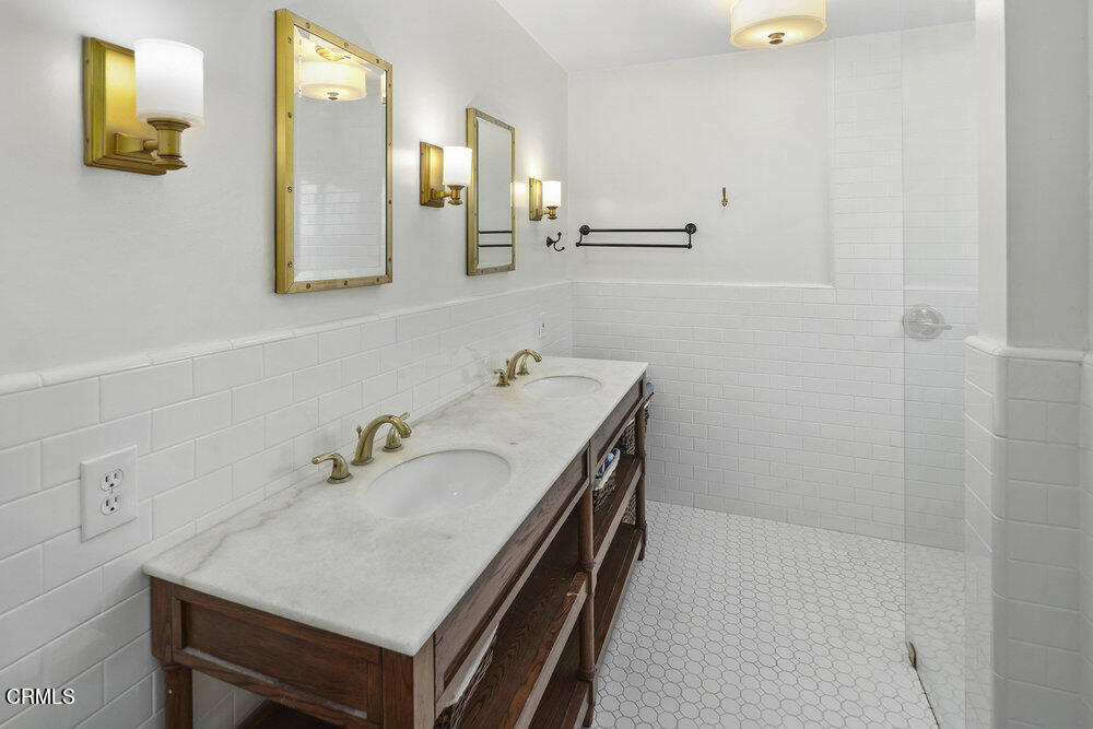 3657 Thorndale Road Pasadena, CA 91107 - Photo 27 of 44 a bathroom with a sink and a mirror
