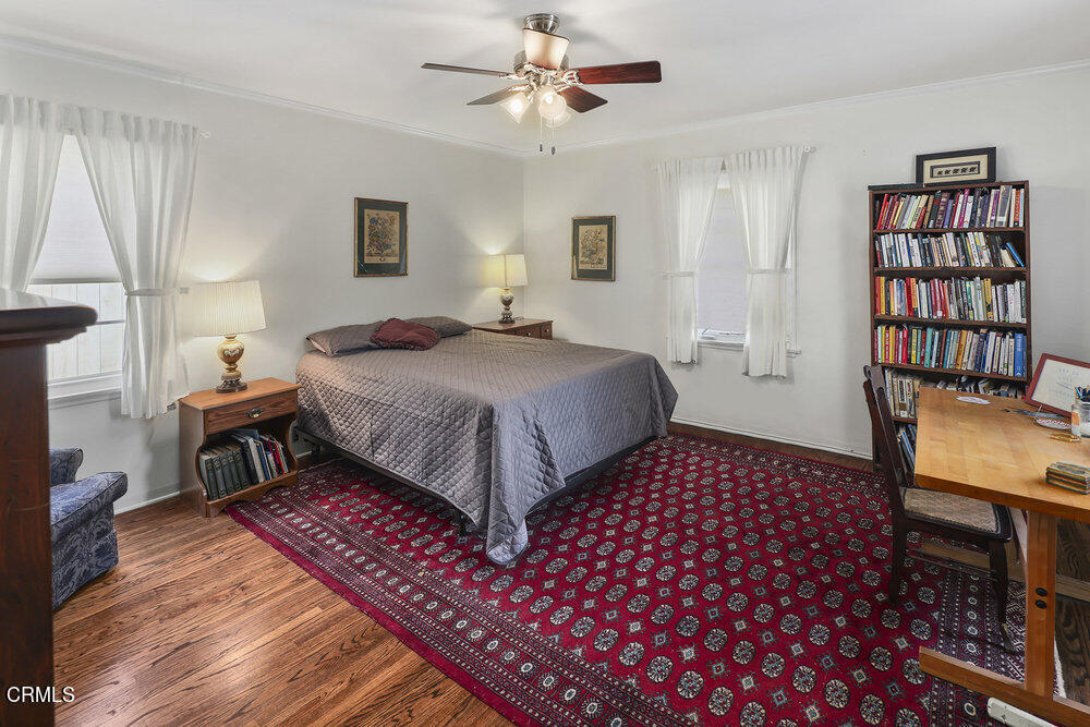 3657 Thorndale Road Pasadena, CA 91107 - Photo 30 of 44 a bedroom with a bed and a chandelier