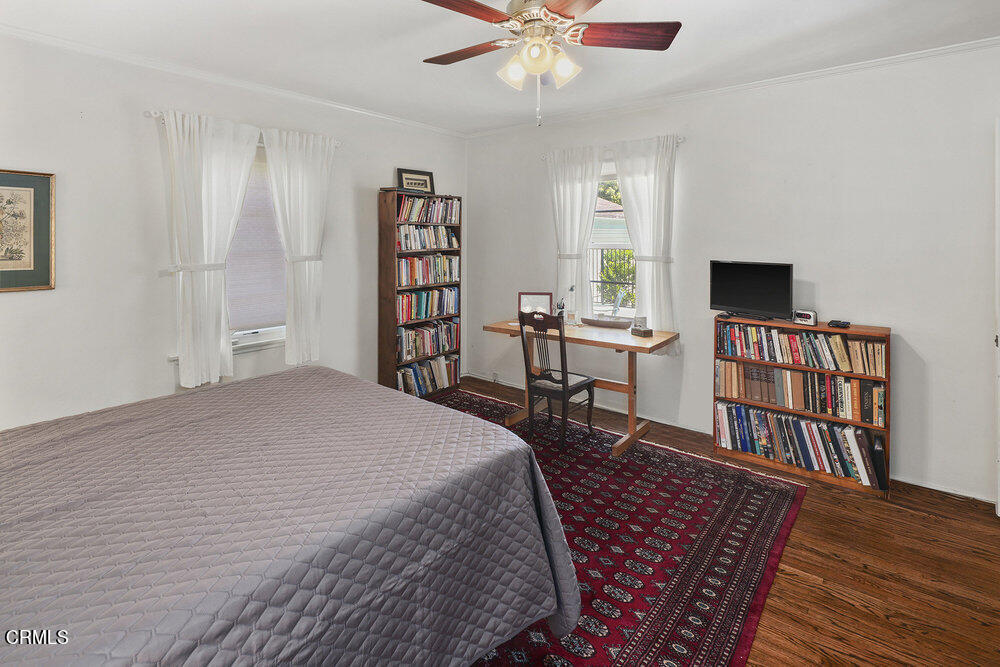 3657 Thorndale Road Pasadena, CA 91107 - Photo 31 of 44 a bedroom with a bed furniture and a bookshelf