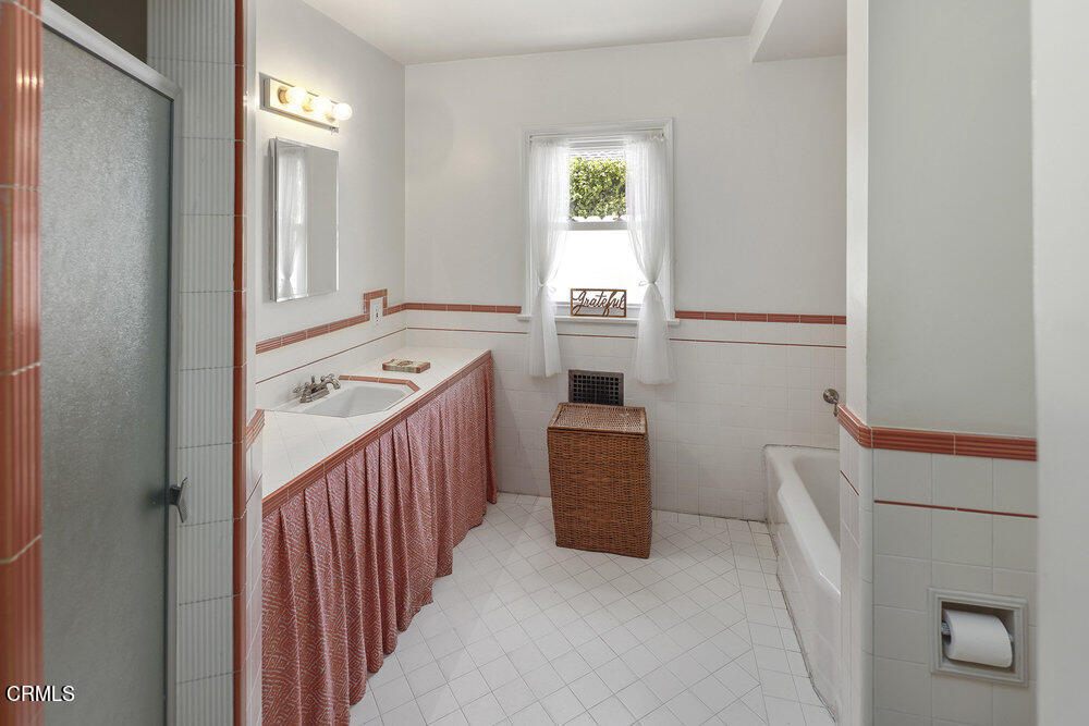 3657 Thorndale Road Pasadena, CA 91107 - Photo 32 of 44 a hallway with cabinets a washer and dryer