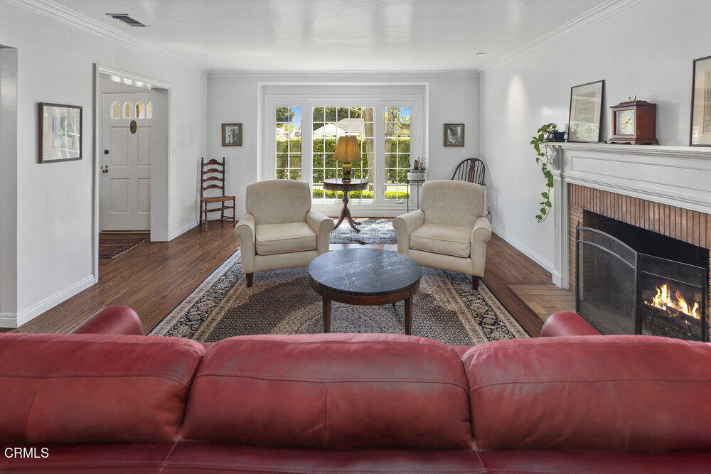 3657 Thorndale Road Pasadena, CA 91107 - Photo 6 of 44 a living room with furniture fireplace and large windows