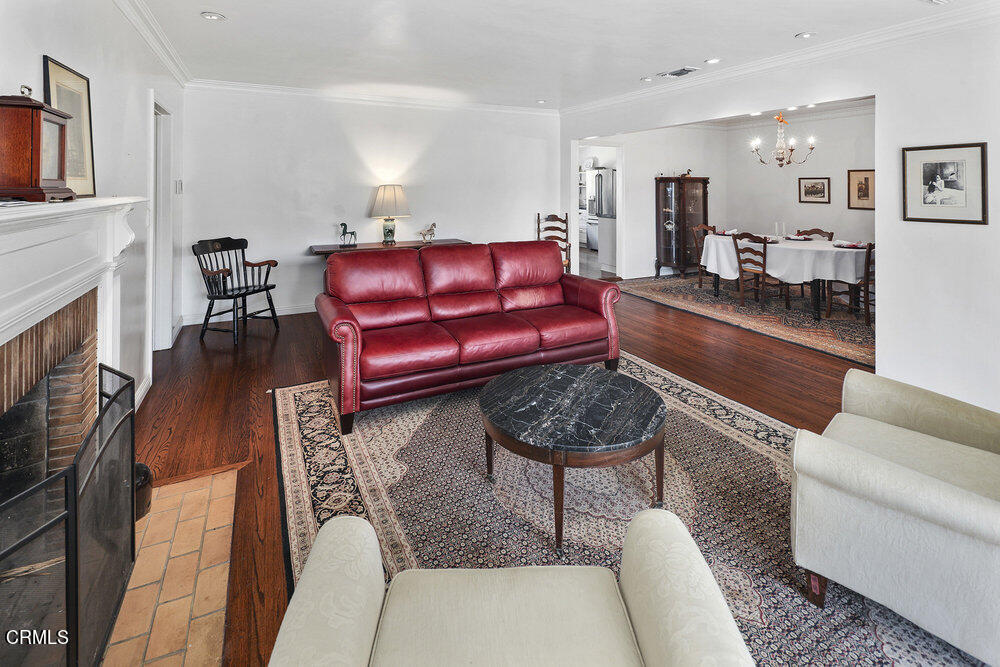3657 Thorndale Road Pasadena, CA 91107 - Photo 9 of 44 a living room with furniture and a fireplace