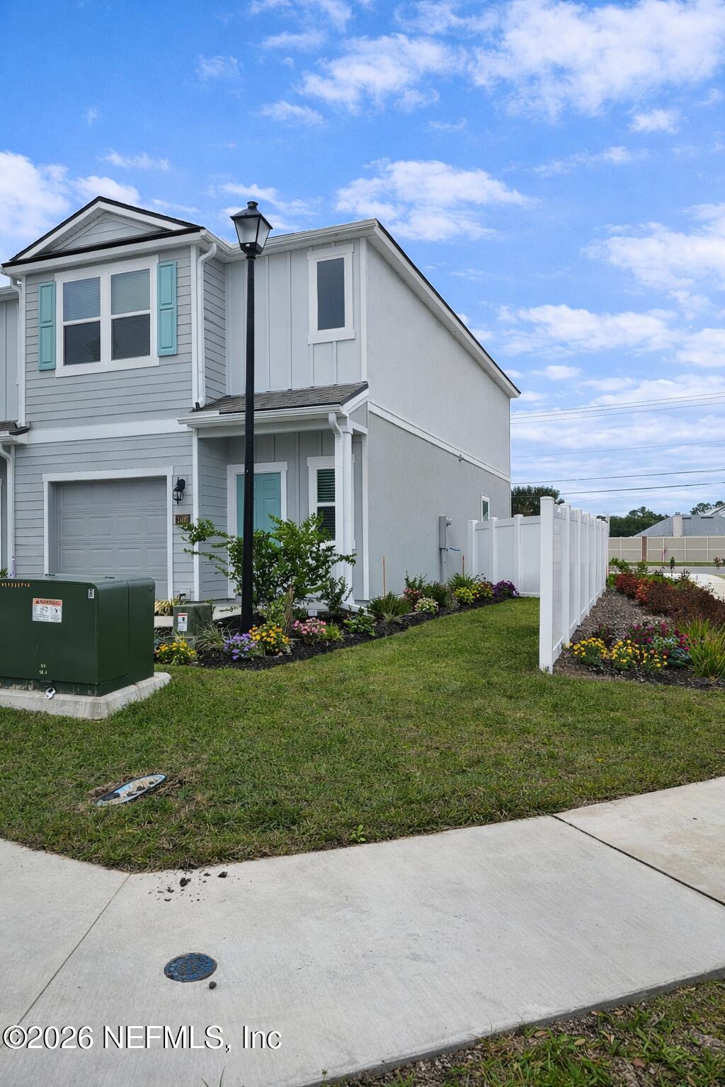1460 Jeremiah Street Middleburg, FL 32068 - Photo 2 of 3 a front view of a house with a yard