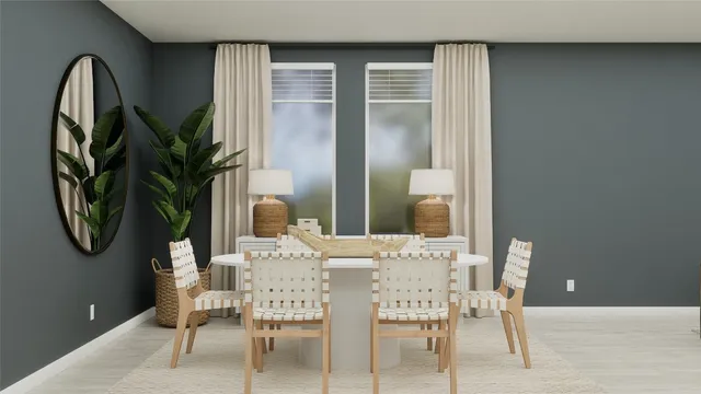 a dining room with furniture and a potted plant