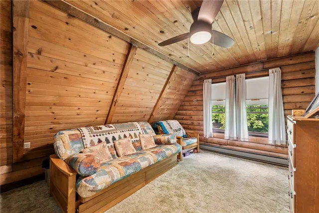 a spacious bedroom with a bed and a large window