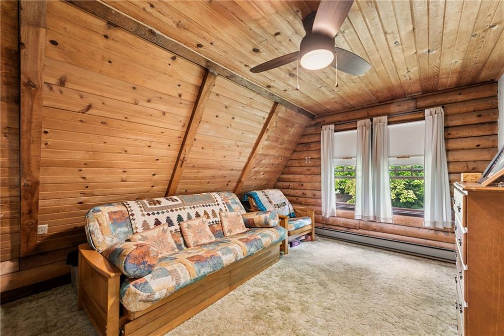 123 Crestview Drive Acme, PA 15610 - Photo 14 of 20 a spacious bedroom with a bed and a large window