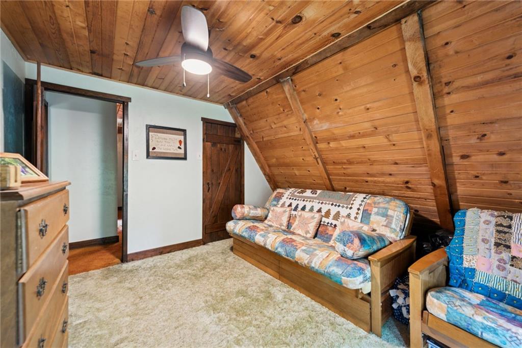 123 Crestview Drive Acme, PA 15610 - Photo 15 of 20 a bed sitting in a bedroom next to a window