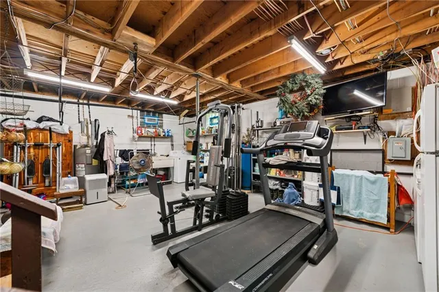 a view of a house with a yard and tree s