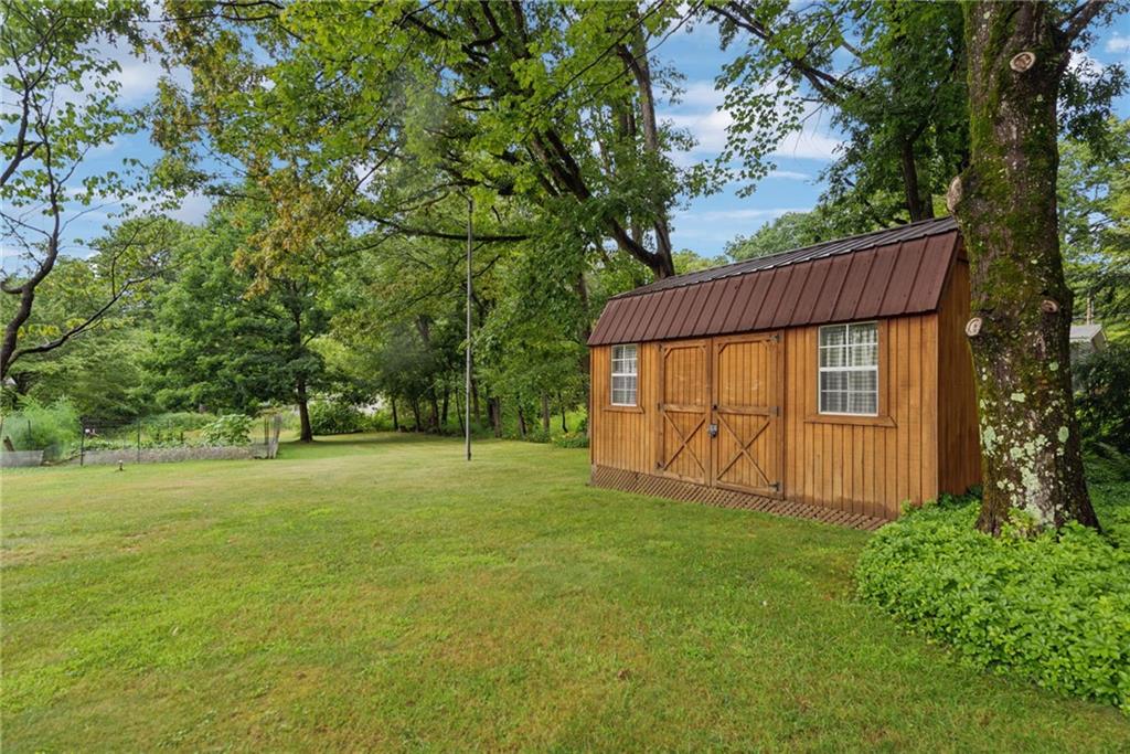 123 Crestview Drive Acme, PA 15610 - Photo 19 of 20 a view of a house with a yard and tree s