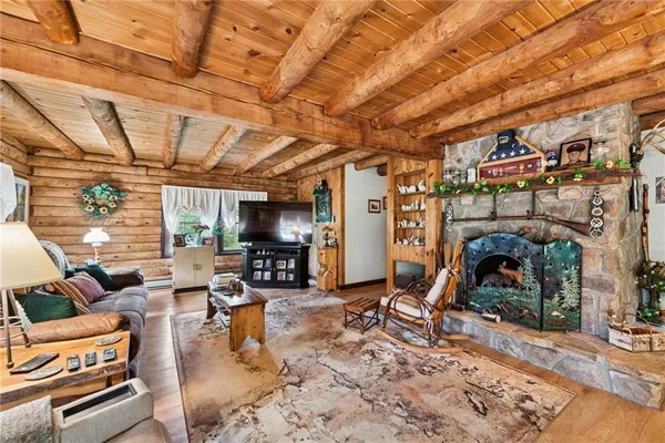 a living room with lots of furniture and a fireplace