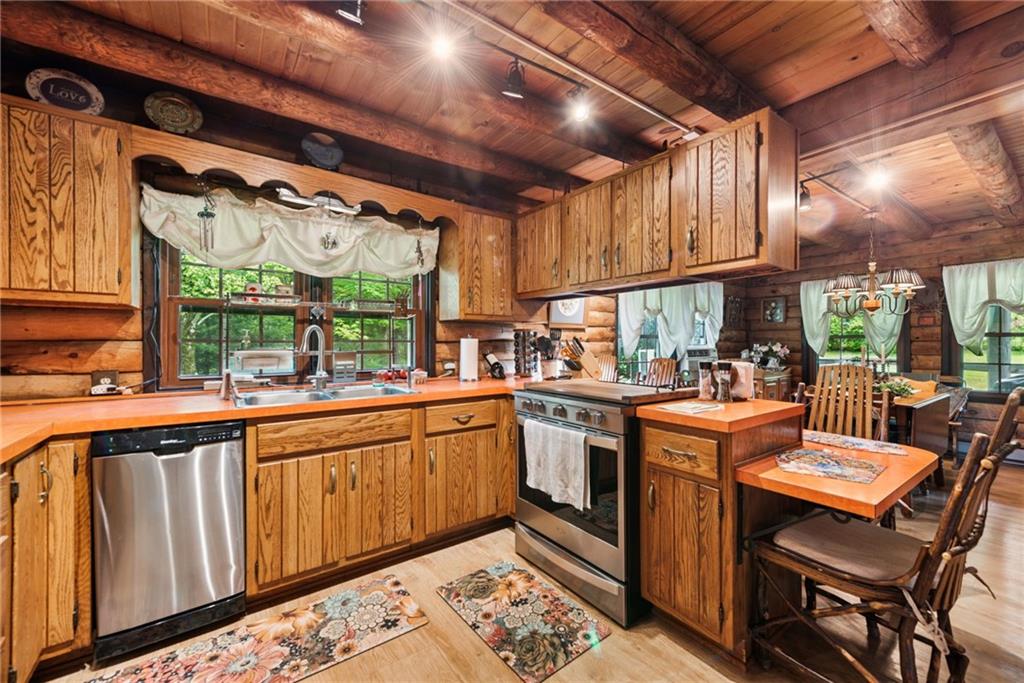 123 Crestview Drive Acme, PA 15610 - Photo 6 of 20 a open kitchen with stainless steel appliances granite countertop a sink and cabinets
