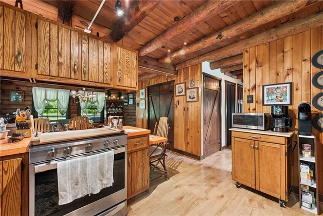 a kitchen with stainless steel appliances granite countertop a stove and a refrigerator