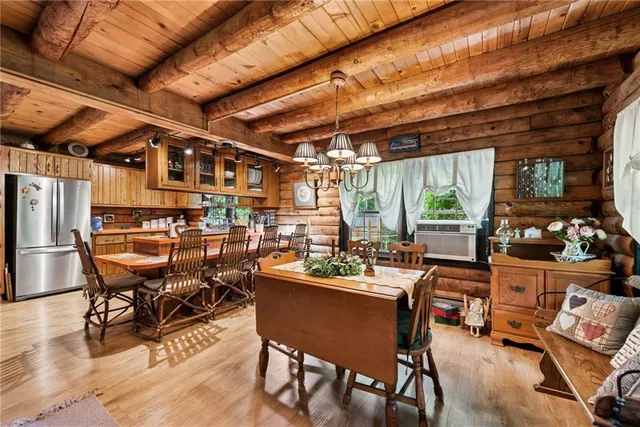 a dining area with furniture outdoor kitchen view and a faucet